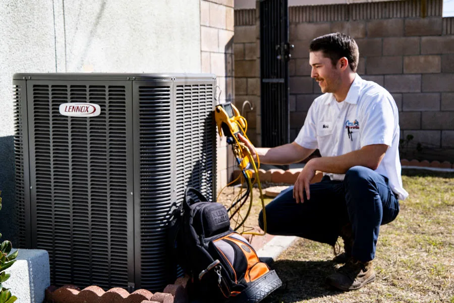 Cypress Air Conditioning technician working on outside A/C unit